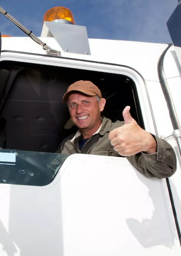 Truck driver giving thumbs up.